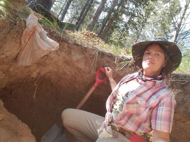 Regina Cal, professional prospector, digging for crystals