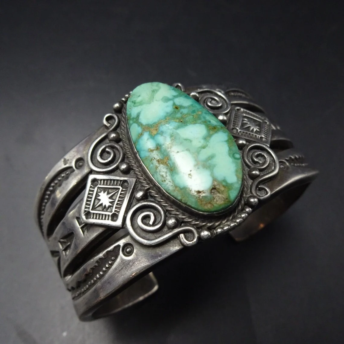 This bracelet features a gorgeous specimen of Carico Lake turquoise secure in smooth bezel, on a foundation of heavy gauge, hand stamped sterling silver.